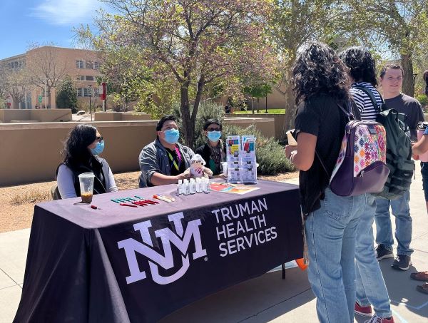 Students speak to representatives from UNM Truman Health Services.