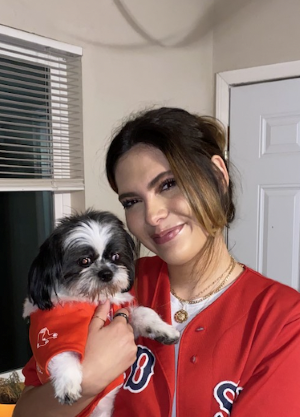 Lianna Maldonado poses with her dog Milo.