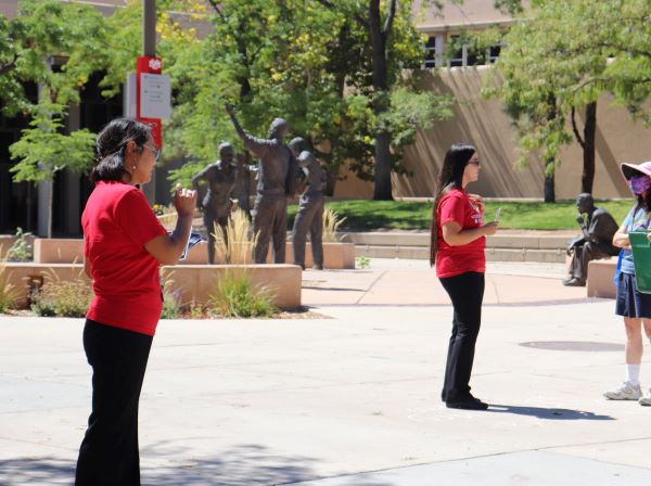 SHAC staff greet students on the Cornell Mall.