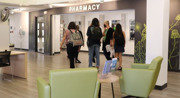Students take a tour of the SHAC Pharmacy lobby.