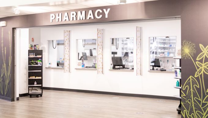 Exterior photo of SHAC Pharmacy walk-up windows and lobby area.