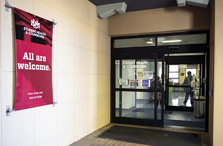 SHAC Entrance with "All are welcome" banner.