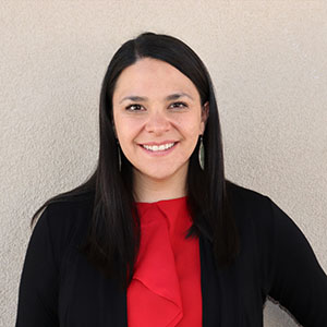 Tiffany Martinez-Durant poses against an adobe wall.