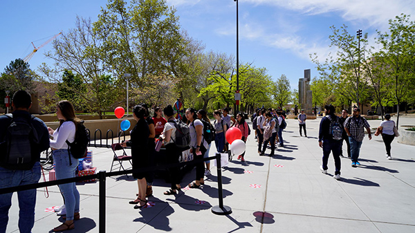 Students gather on the Cornell Mall for the Condom-Mint Celebration.