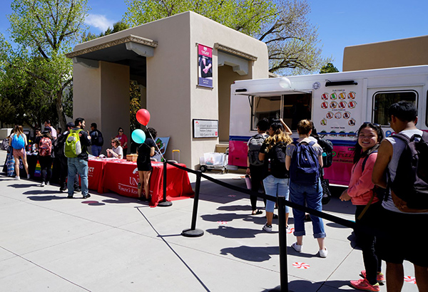 Students line up to get free paletas from a Pop Fizz truck.