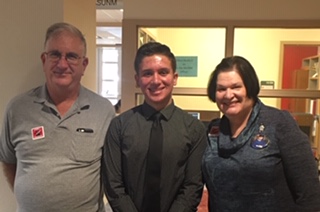 Student Crucificio Caputo stands between Ron and Elaine Plotkin.