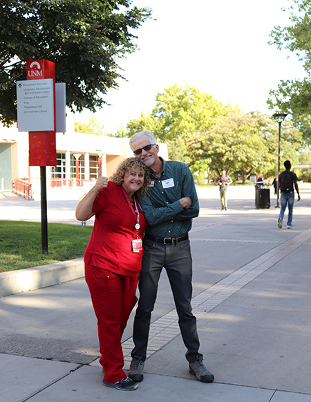 Two SHAC medical staff greet students on the mall.