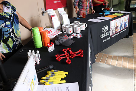 Freebies at the SHAC Open House included mugs, highlighters, and hand sanitizers.