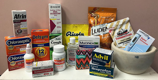 SHAC offers a variety of OTC items for COVID care (e.g., throat lozenges, cough medicine, pain relievers, etc.).