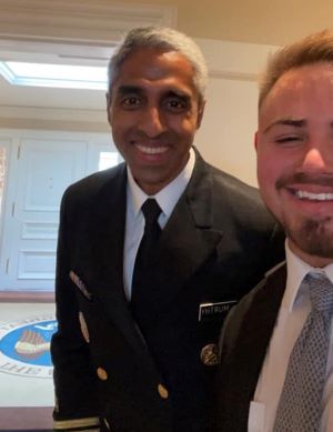 Vivek Murthy and Chris Naranjo smile for the camera.